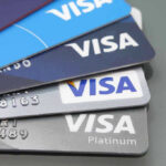 Stacked Visa credit cards in various colors