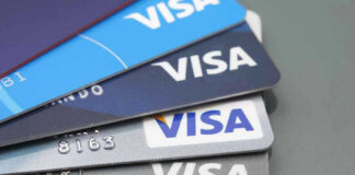 Stacked Visa credit cards in various colors