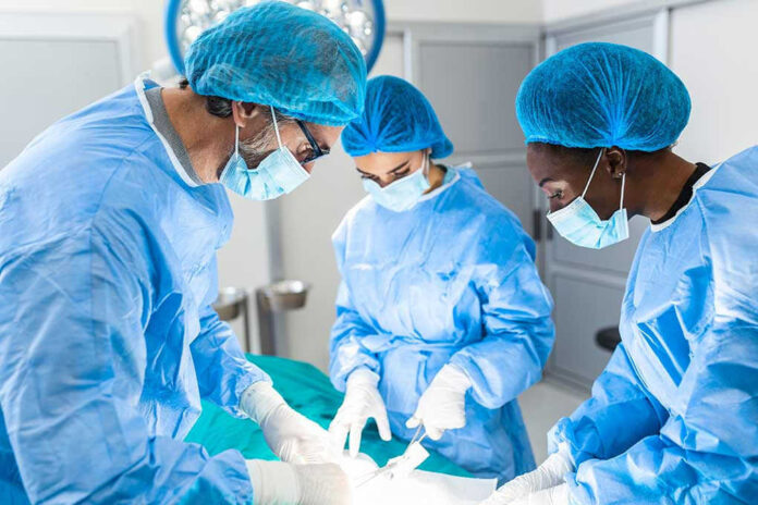 Surgeons performing an operation in a sterile environment