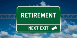 Green road sign reading retirement next exit sky background