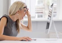 Adult Star Marries Victim’s Son After BEHEADING A woman with blonde hair showing a surprised expression while looking at a computer