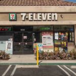 Exterior view of a 7-Eleven convenience store with an ATM