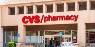 Exterior view of a CVS pharmacy store with customers entering