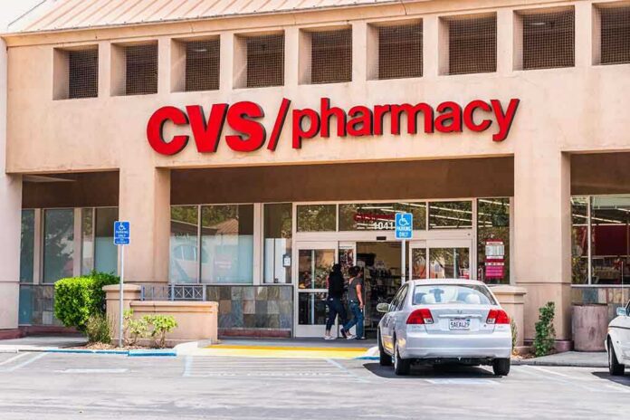 Exterior view of a CVS pharmacy store with customers entering