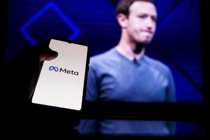 A hand holding a smartphone displaying the Meta logo with a blurred figure in the background