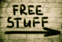 Graffiti on a brick wall stating FREE STUFF with an arrow