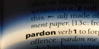 The word pardon highlighted in a dictionary.