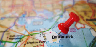 Red pushpin marking Baltimore on a map.