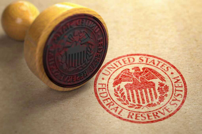 Federal Reserve stamp and wooden stamp on paper