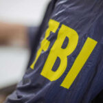 FBI jacket with yellow lettering.