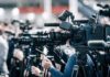 Camp Mystic’s SHOCK Closure: 27 Lives Lost! Broadcast cameras on tripods at a press event